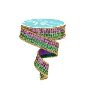 May include: A spool of decorative ribbon with a grid pattern in green and purple, edged with gold tinsel. The ribbon is partially unrolled, revealing a purple underside. The spool has a teal label with white text.