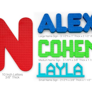 May include: Three personalized name signs made of colorful plastic blocks. The top sign reads "ALEX" in blue blocks, the middle sign reads "COHEN" in green blocks, and the bottom sign reads "LAYLA" in light blue blocks. The signs are available in three sizes: large, medium, and small. The signs are 3/8 inch thick.