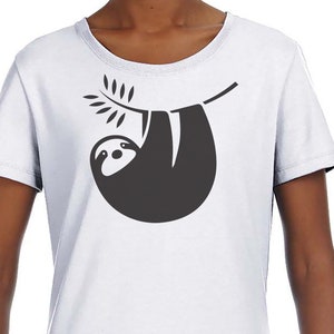 May include: White t-shirt with a black silhouette of a sloth hanging from a branch.