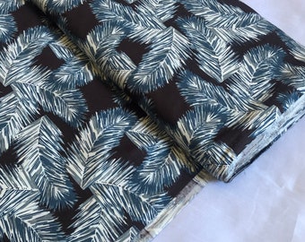 May include: Black fabric with a white and blue geometric pattern of stylized leaves.