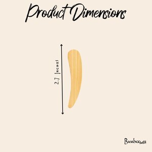 May include: A light tan bamboo spatula with a curved shape. The text Product Dimensions is at the top, and the text Bamboo Switch is at the bottom right. A vertical line with arrows indicates a length of 2.7 inches next to the spatula.
