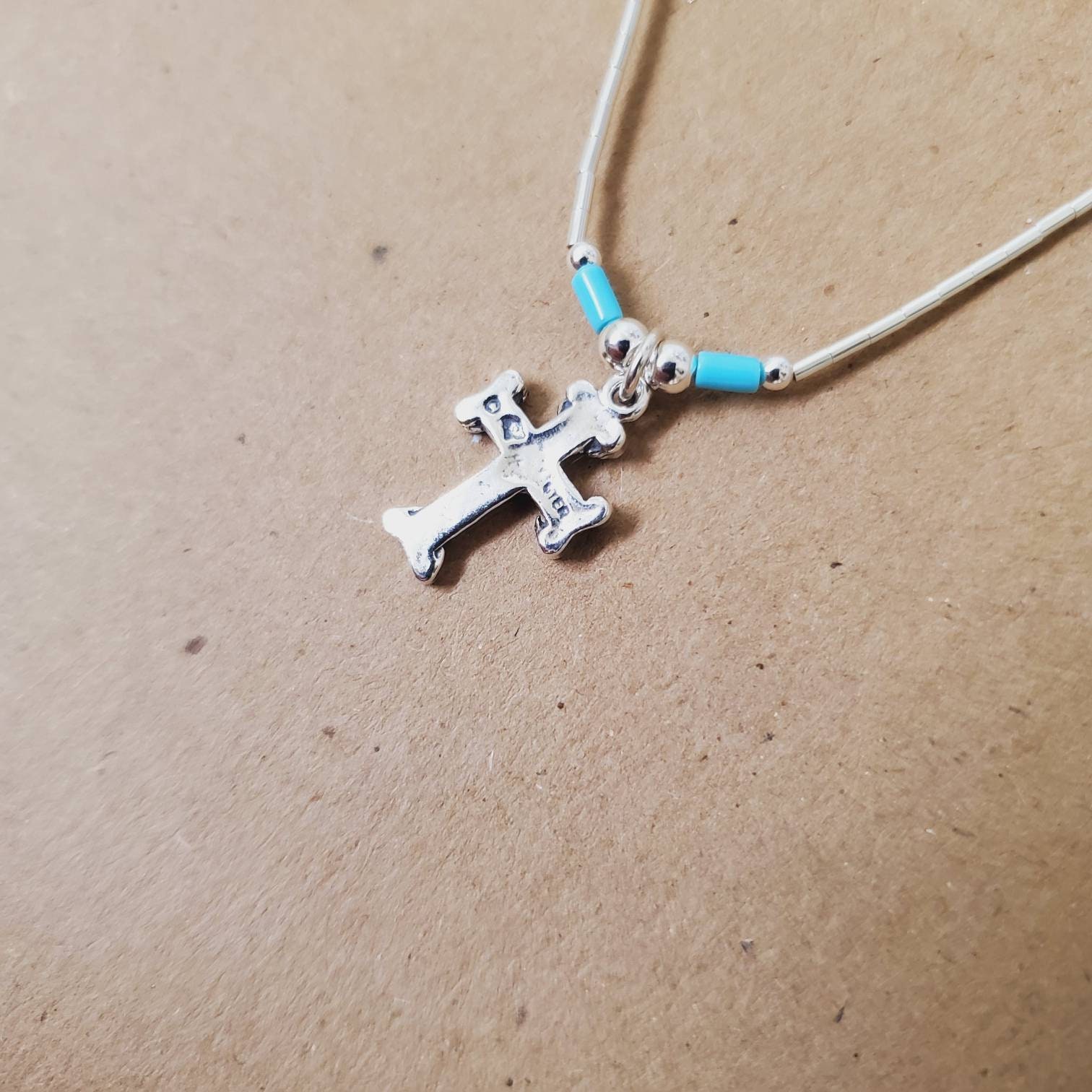 Q925 Small Silver Cross Pendant With Liquid Silver Chain