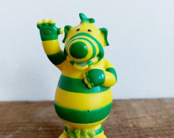 LOS FIMBLES CBEEBIES Personaje Fimbo de rayas verdes y amarillas