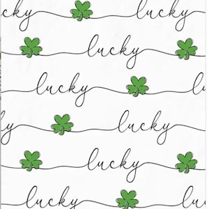 May include: White paper napkins with a repeating pattern of the word "lucky" in black script and green shamrocks. The design is simple and elegant, perfect for St. Patrick's Day or a themed event.