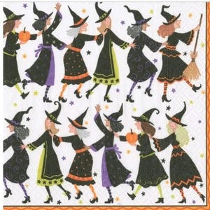 May include: A white background with a repeating pattern of black witches dancing. The witches are wearing black hats, black dresses, and colorful tights. Some of the witches are holding brooms and pumpkins.