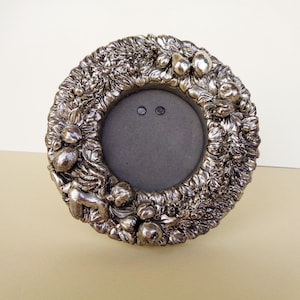 Pewter frame with Astuni brand, vintage Italy  depicting angel and fruit in relief