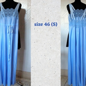 May include: A light blue, long, sleeveless nightgown with a lace trim and a satin ribbon tie. The nightgown is on a mannequin and the text "size 46 (S)" is visible in the image.
