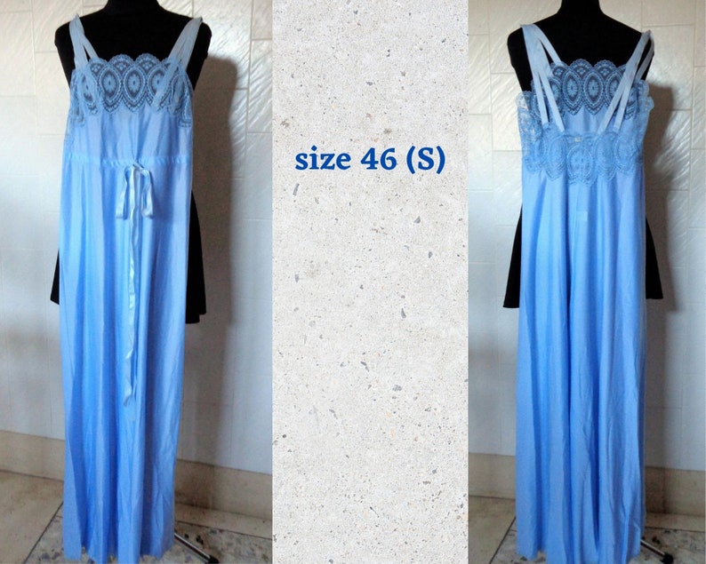 May include: A light blue, long, sleeveless nightgown with a lace trim and a satin ribbon tie. The nightgown is on a mannequin and the text "size 46 (S)" is visible in the image.