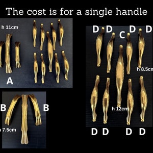 May include: Assortment of gold-toned cabinet door handles in various sizes and styles. The handles are arranged in groups labeled A, B, C, and D. The text "The cost is for a single handle" is at the top of the image. Measurements are included in centimeters.