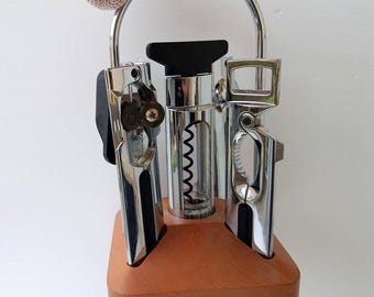 Vintage Italian '80s Foppapedretti branded kitchen bar utencils set, corkscrew, crushing, opener canned boxes on handled  solid wooden base.
