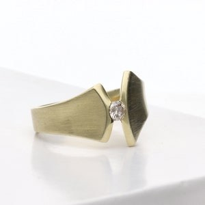 Unusual 14 k yellow gold solitaire ring with 0.1 ct diamond