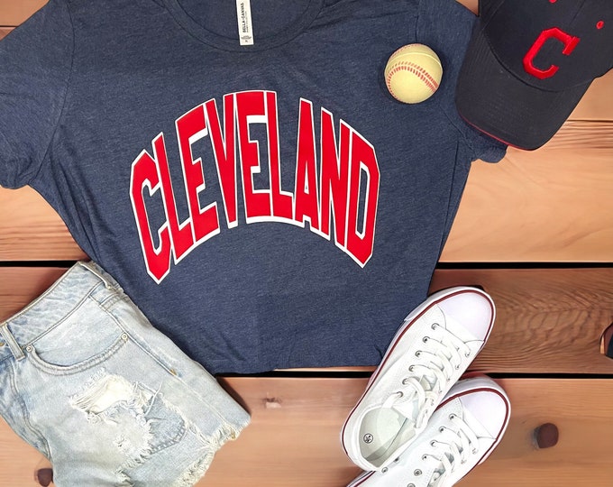 Featured listing image: Cleveland Baseball, Heather Navy, Flowy crop top, comes in sizes Small - 2X. Weighing 3.7 oz, 65% polyester and 35% viscose.
