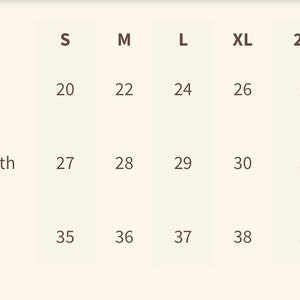 May include: Size chart showing measurements in inches for body width, full body length, and sleeve length for sizes S, M, L, XL, 2XL, and 3XL.