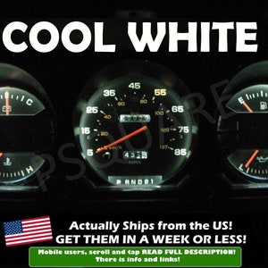 May include: A close-up of a car's dashboard with three gauges. The gauges are illuminated with a cool white light. The gauges show the speedometer, fuel level, and oil pressure. The text "COOL WHITE" is displayed at the top of the image.