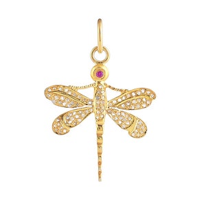 May include: A gold dragonfly pendant with a ruby red gemstone in the center and clear sparkling stones on the wings.