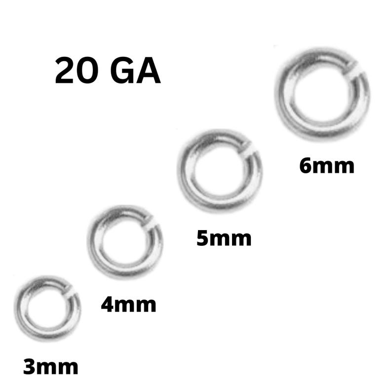 May include: Silver-colored jump rings in various sizes, including 3mm, 4mm, 5mm, and 6mm. The text "20 GA" is displayed at the top left. These rings are commonly used in jewelry making and crafting.