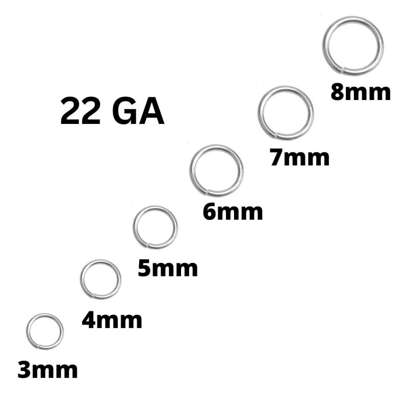 May include: A collection of silver-colored jump rings in various sizes, ranging from 3mm to 8mm, displayed against a white background. The text "22 GA" is also present. The sizes are clearly labeled in millimeters.