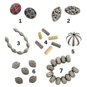 May include: Assortment of silver and gold tone beads with various designs, including round, oval, and cylindrical shapes. Some beads are embellished with diamonds, while others feature intricate floral patterns.