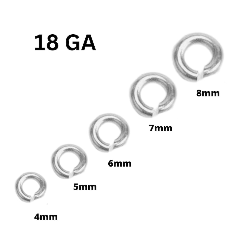 May include: A collection of silver-colored jump rings in various sizes, ranging from 4mm to 8mm. The text "18 GA" is displayed above the rings, indicating the gauge of the wire used. These rings are commonly used in jewelry making and crafts.