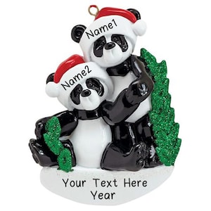May include: Personalized Christmas ornament featuring two pandas wearing Santa hats and holding a green Christmas tree. The ornament has the text "Name1", "Name2", "Your Text Here", and "Year" on it.