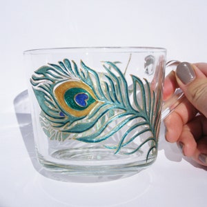 Glass coffee mug with peacock feathers hand painted