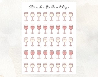 May include: A sheet of stickers featuring wine glasses in two colors: clear and pink. The stickers are arranged in rows and columns. The text "Stick It Pretty" is written in cursive at the top of the sheet. The background is a light watercolor wash.