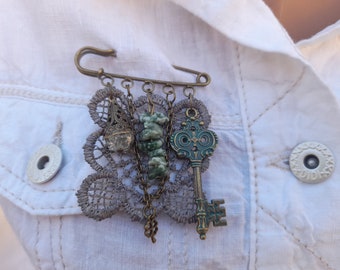 Mixed Media Brooch Fabric Wearable Art Handmade Lapel Pin Assemblage With Antique Bronze Charms Key Lace and Chain