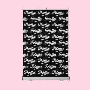 May include: A black retractable banner featuring a repeating white script that reads "Printlux". The banner is mounted on a silver stand, ready for display.