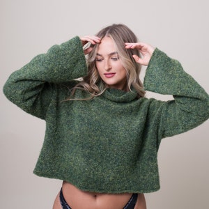 Forest green cropped knitted jumper hand made in England. Relaxed fit boxy wide roll neck green pullover