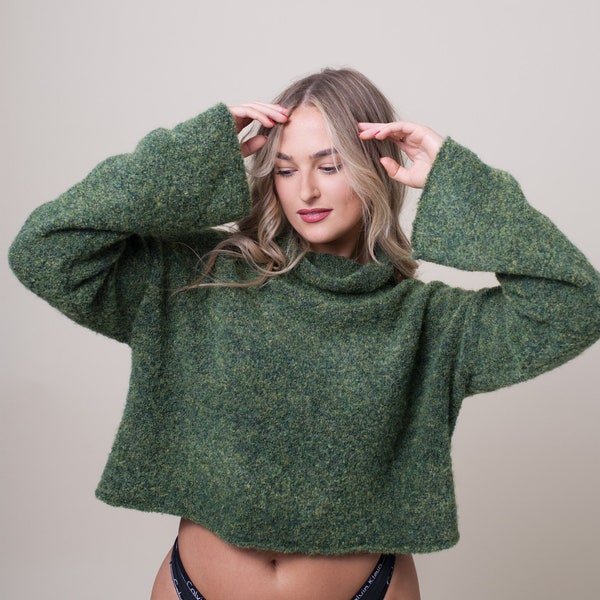 Forest green cropped knitted jumper hand made in England. Relaxed fit boxy wide roll neck green pullover