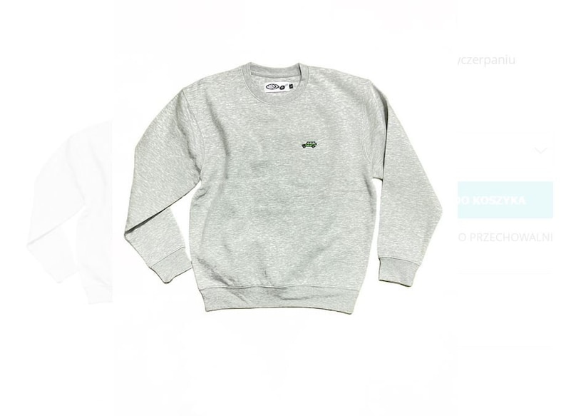 May include: A grey sweatshirt with a small green car embroidered on the front. The sweatshirt has a crew neck and long sleeves.