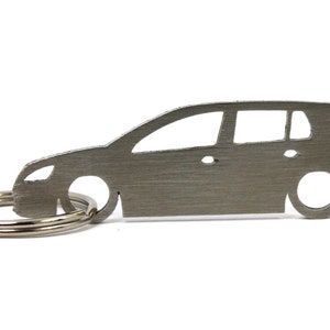 May include: A silver-coloured car-shaped keyring. The keyring is a silhouette of a hatchback car, with details like windows, headlights, and wheels. It is attached to a silver key ring.