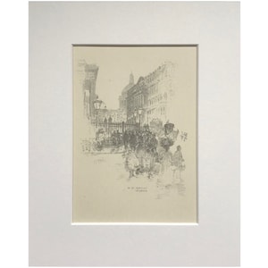Puede incluir: Un grabado en blanco y negro de una escena callejera en París, Francia. El grabado representa una calle bordeada de edificios, con gente caminando y carruajes pasando. El texto "En St. Martin le Grand" es visible en la parte inferior del grabado.