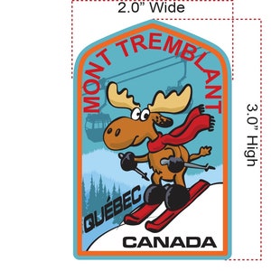 May include: A cartoon moose wearing a red scarf and skiing down a mountain with the text "MONT TREMBLANT QUEBEC CANADA" on a blue background. The patch is 3 inches high and 2 inches wide.