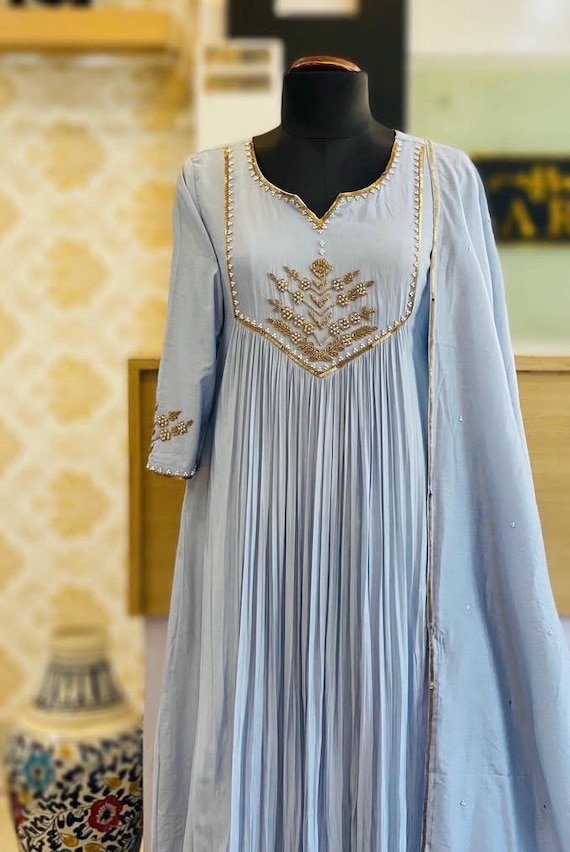 blue and gold anarkali dress Make your wedding look unforgettable with the Zivara Blue Wedding Wear  Embroidered Anarkali Suit Set  A graceful blend of tradition and modern  royal charm  Designed with intricate embroidery and flowing