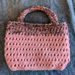 Handmade knitted purse, coral eyelets with black fringe