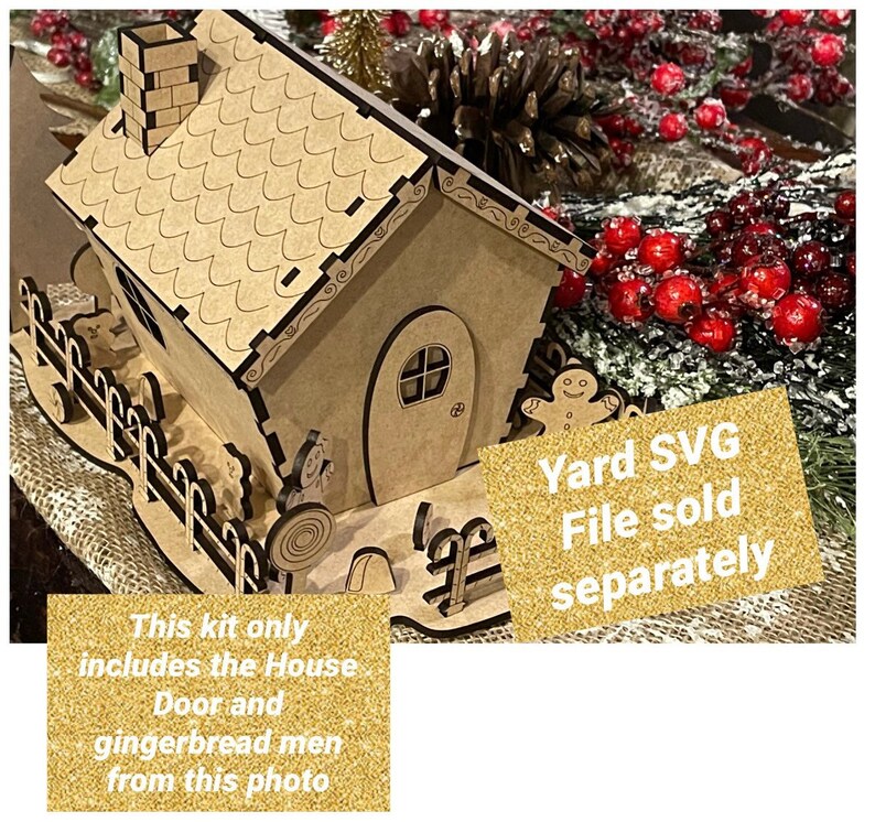 May include: A wooden gingerbread house kit with a brown roof, white trim, and a gingerbread man figurine. The kit includes the house, door, and gingerbread men. The text "Yard SVG File sold separately" is on a gold glitter background.