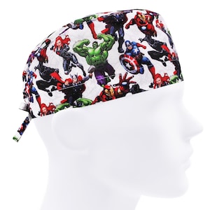 May include: A white scrub hat with a colorful print of various Marvel superheroes, including Iron Man, Captain America, Hulk, and Black Widow.