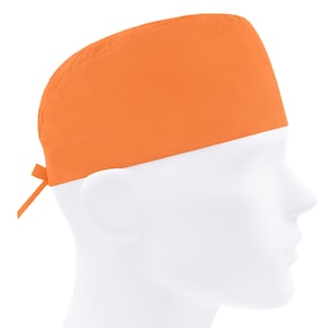 May include: Orange scrub cap with a tie at the back. The cap is made of a soft, breathable fabric.