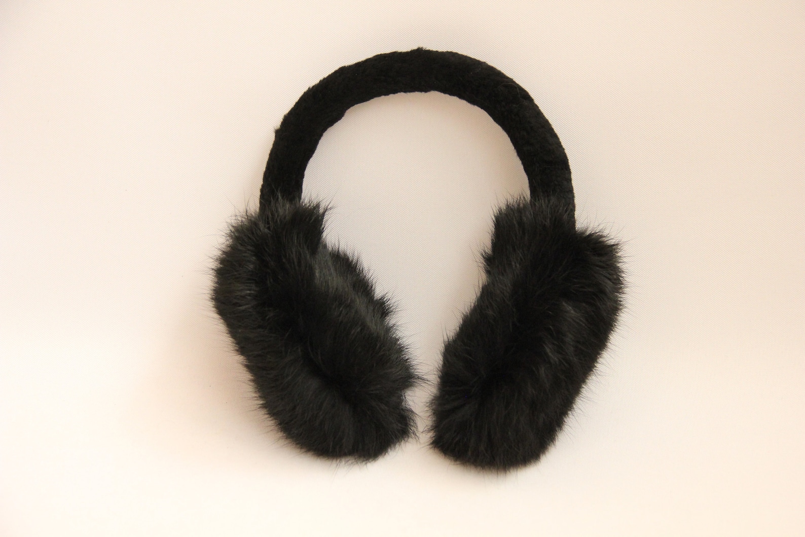 Soft black fur earmuffs for blocking sound during bondage restraints or tie up sex sessions