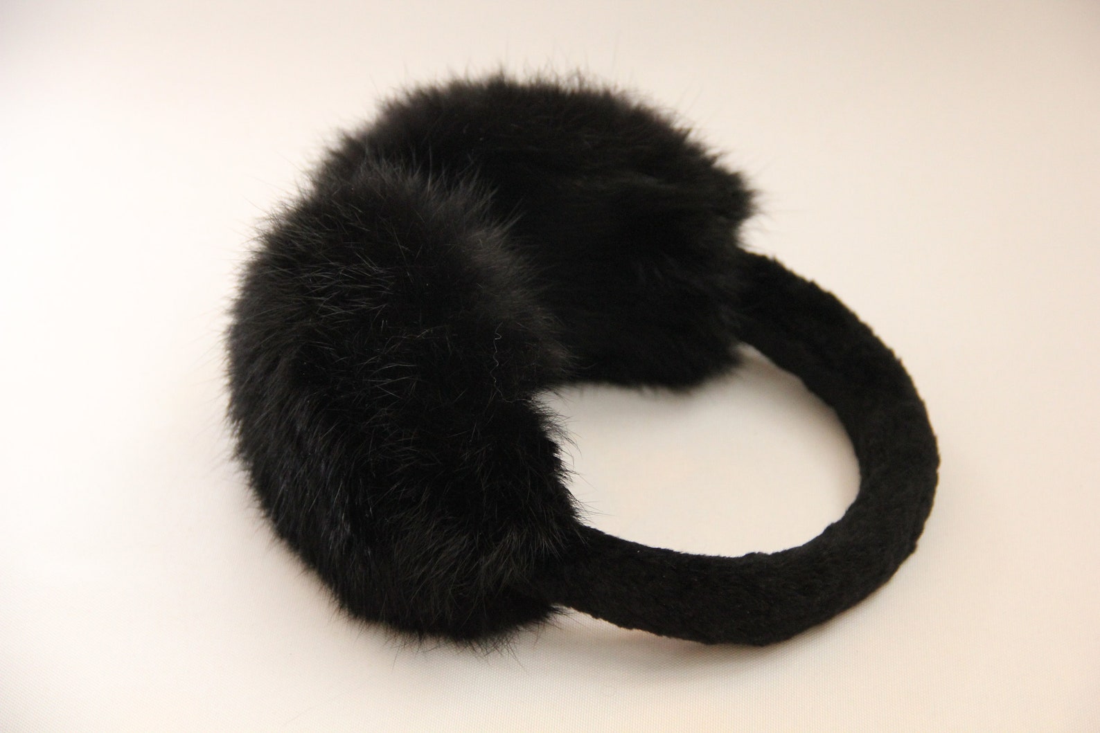 Black rabbit fur earmuffs perfect for sensory deprivation in BDSM restraint play
