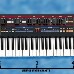 May include: A black Roland Juno-106 synthesizer with a 61-key keyboard, a red and blue control panel, and the text "JUNO-106 PROGRAMMABLE POLYPHONIC SYNTHESIZER". The synthesizer is 4.75 inches wide.
