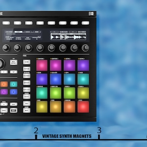 May include: A black Maschine MK3 music production controller with a color-coded pad grid, knobs, and buttons. The controller is 3 inches wide.