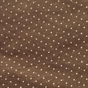 May include: A brown fabric featuring a repeating pattern of small, evenly spaced white polka dots. The material has a slightly translucent quality, showing a consistent texture across the surface with a simple, classic geometric design.