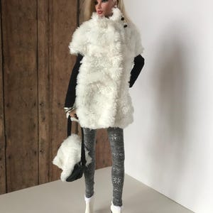 May include: A white faux fur vest with black trim and buttons, worn with gray snowflake patterned tights and white boots.