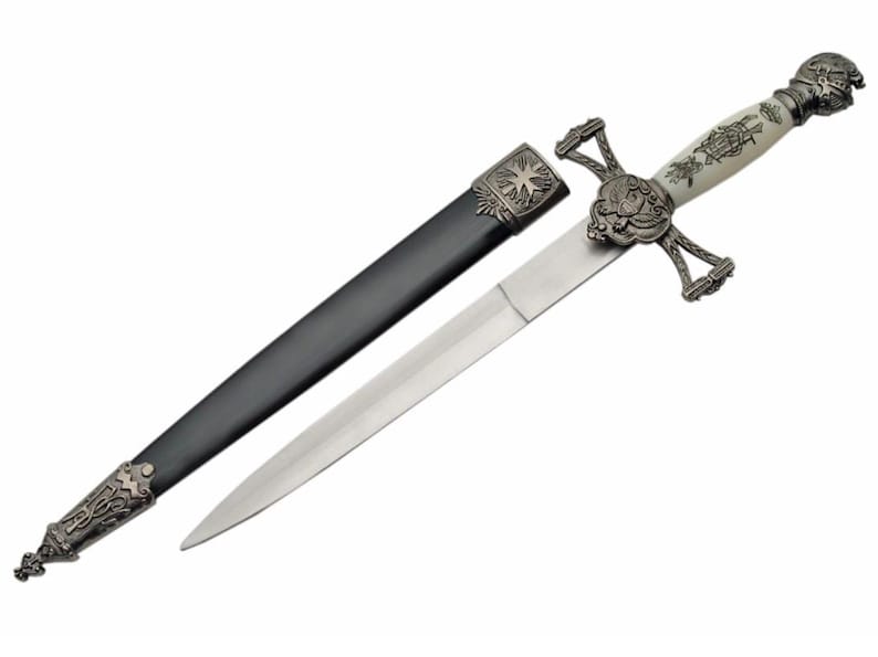 May include: A silver and white dagger with a cross-shaped handle and a black leather scabbard. The handle is decorated with intricate designs and the blade is sharp and pointed.