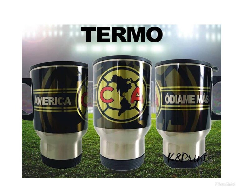 May include: Three stainless steel travel mugs with black and gold designs. The mugs feature the words "America", "Club America", and "Odiame Mas".