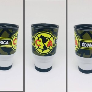 May include: A black and green travel mug with a yellow and red logo that says "Club America" and "Odiame Mas".