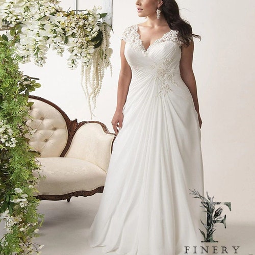 plus size fit and flare wedding dress with sleeves