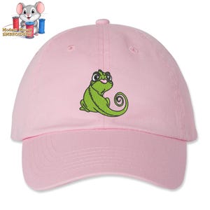 May include: Pink baseball cap with an embroidered green chameleon design.
